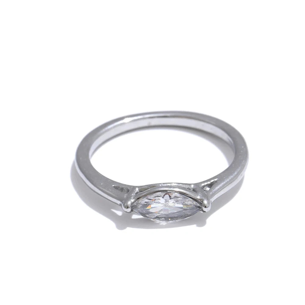 Silver ring with a diamond on a white background