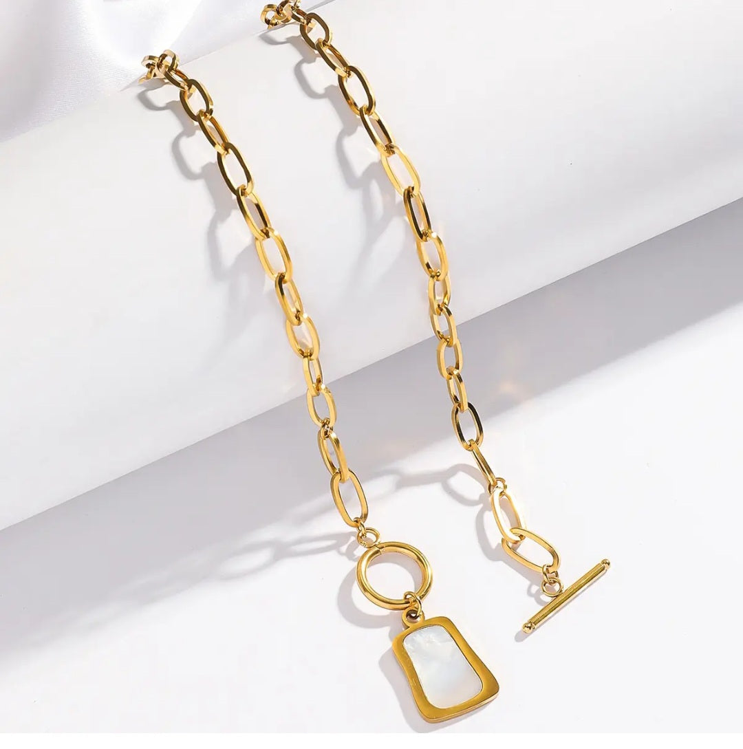 Detail of the necklace's trendy OT toggle buckle and adjustable chain extender.