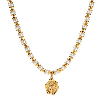 Necklace with gold and pearl beads on a white background