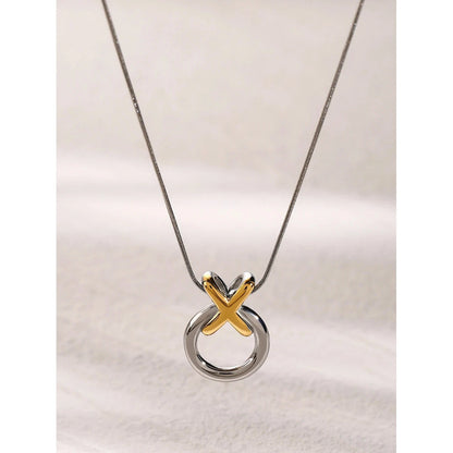 Necklace with a unique pendant featuring a gold 'X' 