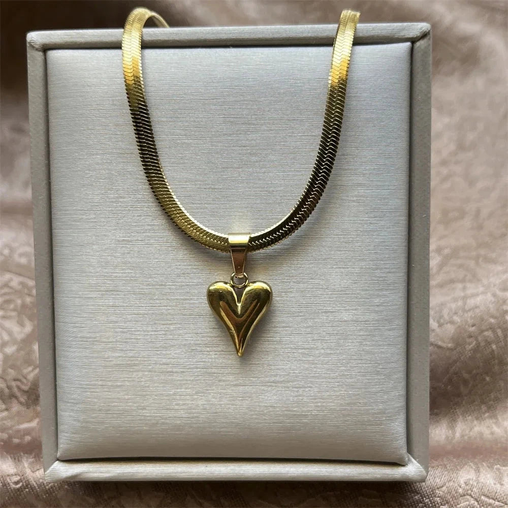 18K Gold-plated heart pendant necklace on a gray box