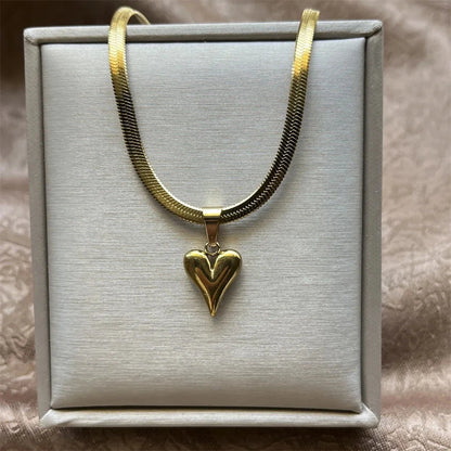 18K Gold-plated heart pendant necklace on a gray box