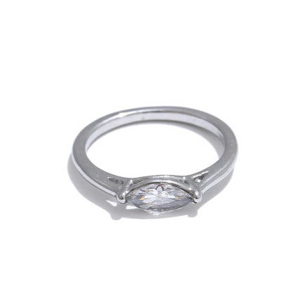 Silver ring with a diamond on a white background