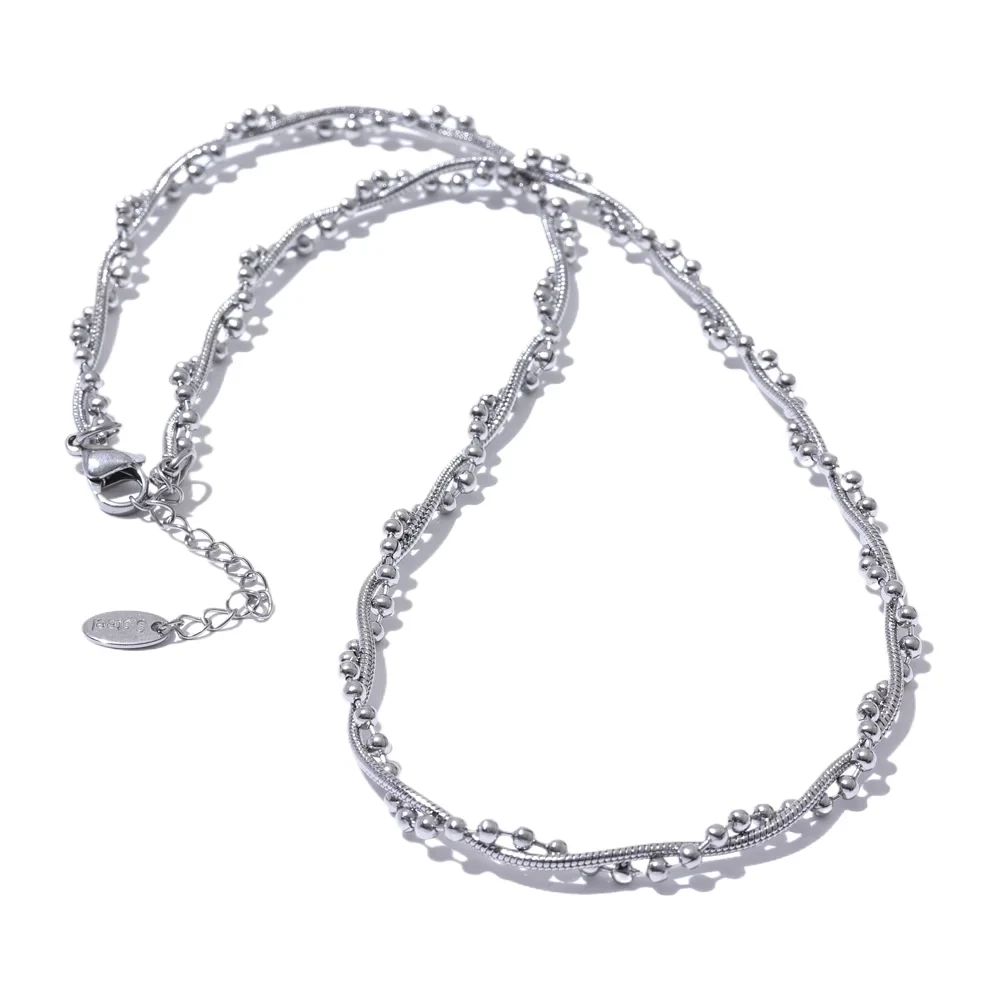 Silver fashion beaded necklace with floral design on a white background