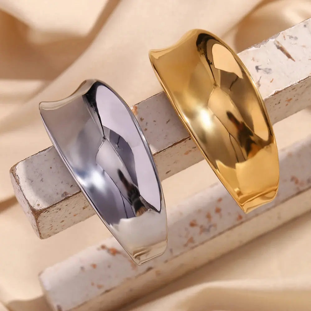 Studio image of the Concave Silver Cuff, highlighting its thick, architectural open-cuff silhouette and dynamic, sculptural surface.