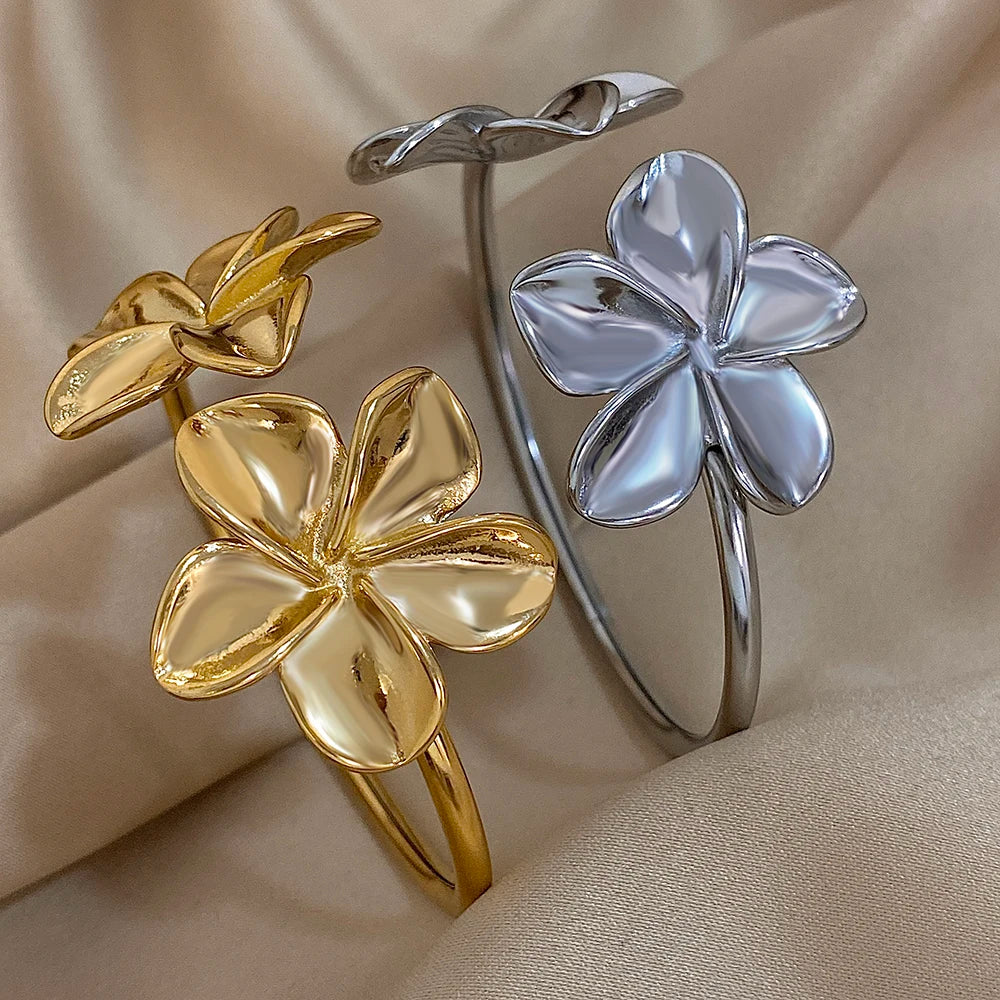 Gold and silver flower-shaped bangles 