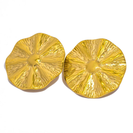 Pair of gold pineapple-shaped earrings on a white background