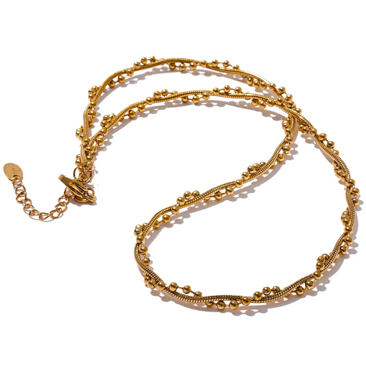 A gold-colored stainless steel chain twine fashion collar necklace with a geometric pattern, displayed against a white background.