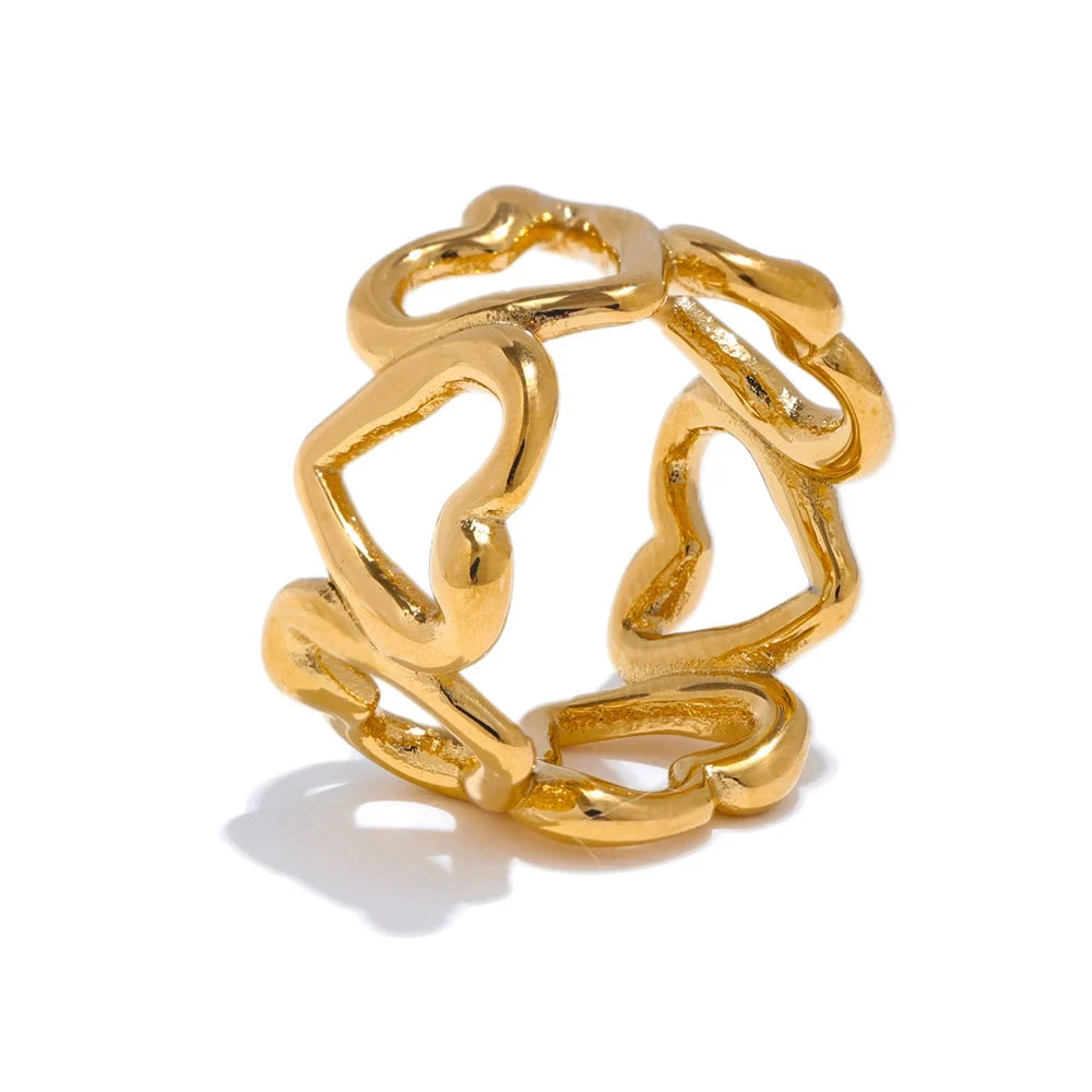 Gold ring with a unique design on a white background