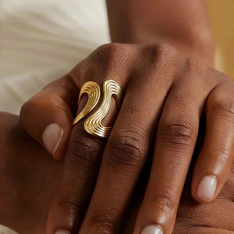 Gold ring on a model's finger w