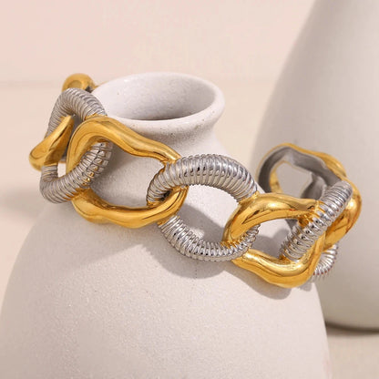 Close-up view of the cuff, highlighting the interlocked, wide links and the high-polish PVD finish.