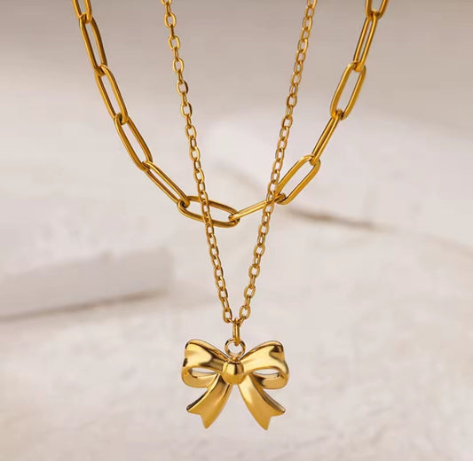 Fashion jewelry gold chain necklace with a bow pendant 