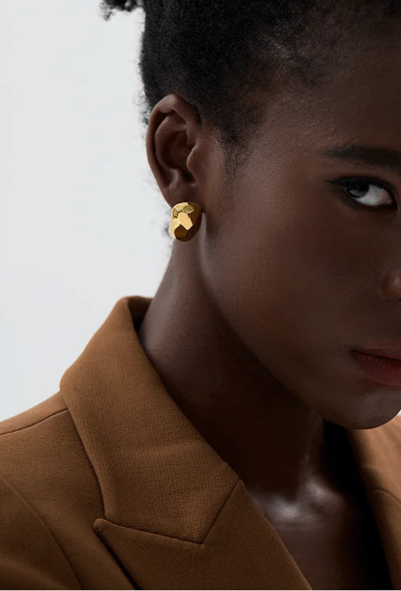 Model wearing Sabrina Sculpted Gold Earrings styled for everyday minimalist elegance.