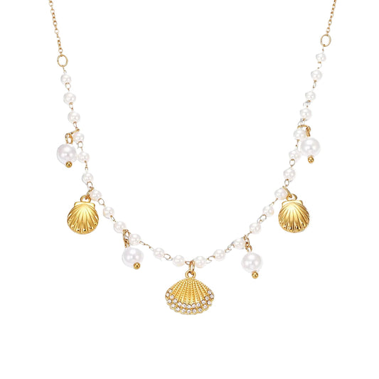 Necklace with gold shell pendants and white beads on a white background, featuring the Inti Jewelry brand.