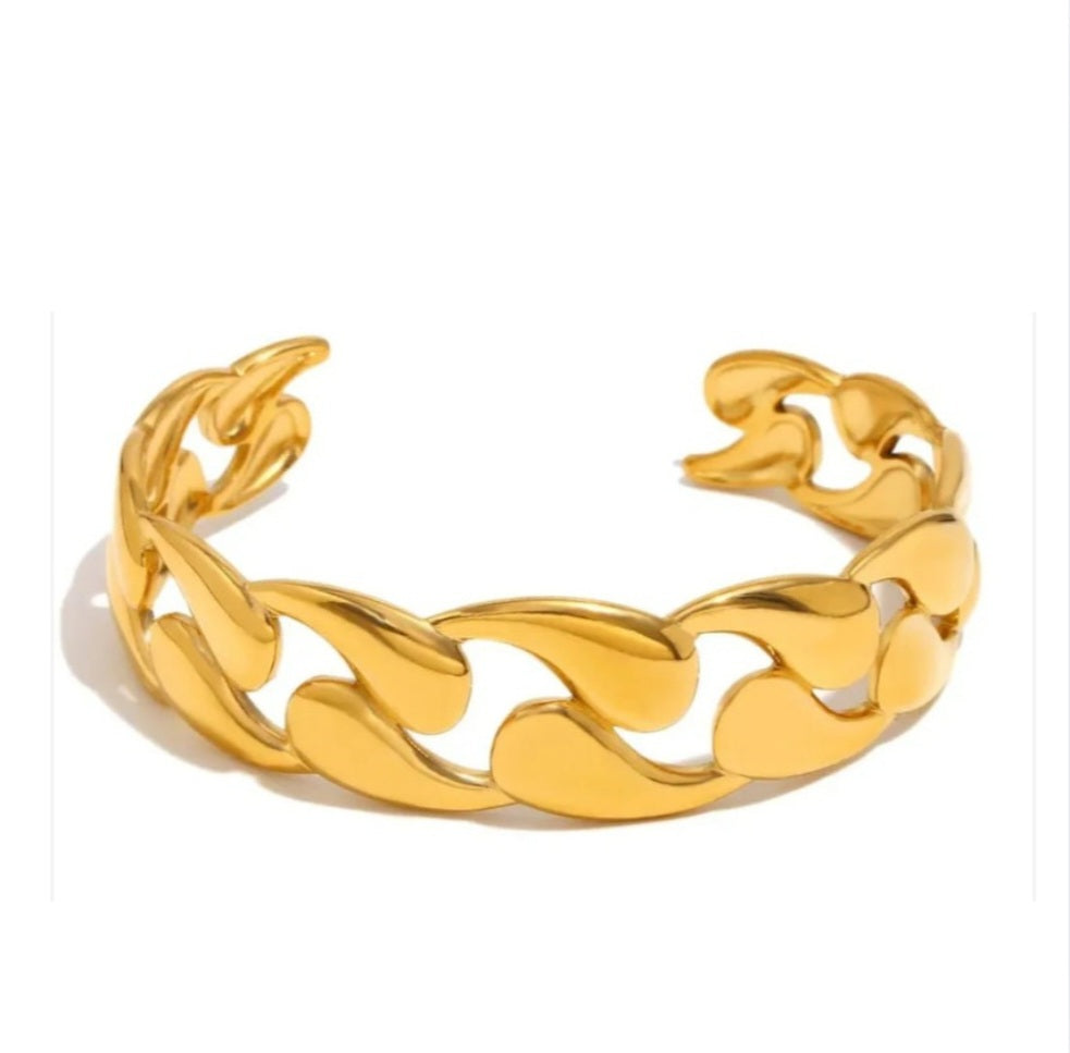 Valentina Luxe Bangle, a wide, highly polished cuff bracelet in PVD Gold-Plated stainless steel.