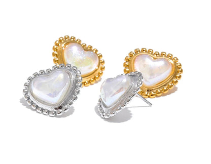 Heart-shaped earrings with gold and silver frames on a white background