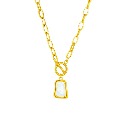 Zena Pendant Necklace in gold-toned 316L stainless steel, featuring a geometric trapezoidal pendant and a dangling pearl oyster charm.